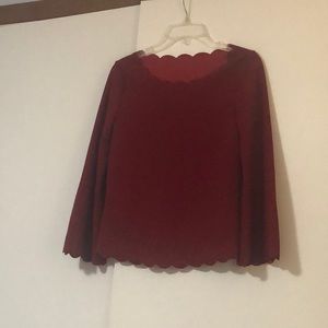 Red scalloped shirt